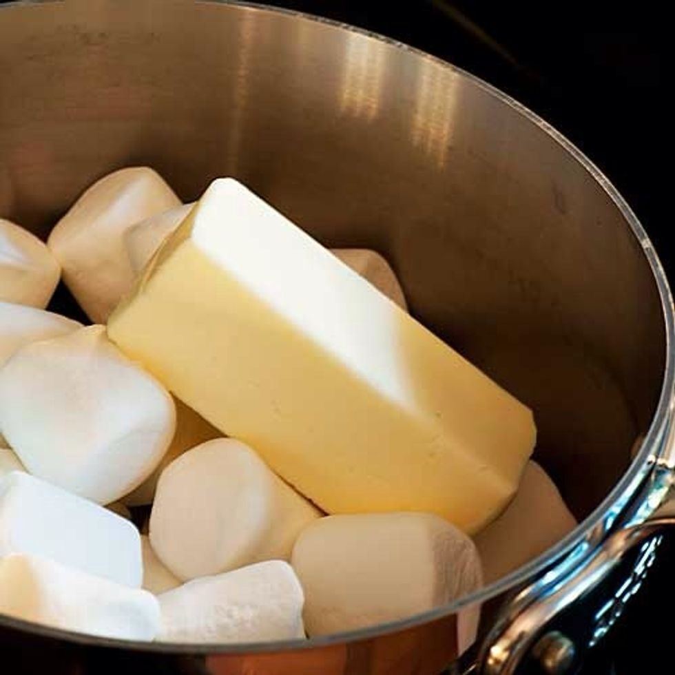 In the saucepan melt the butter and the marshmallows. Make sure to use low heat.
