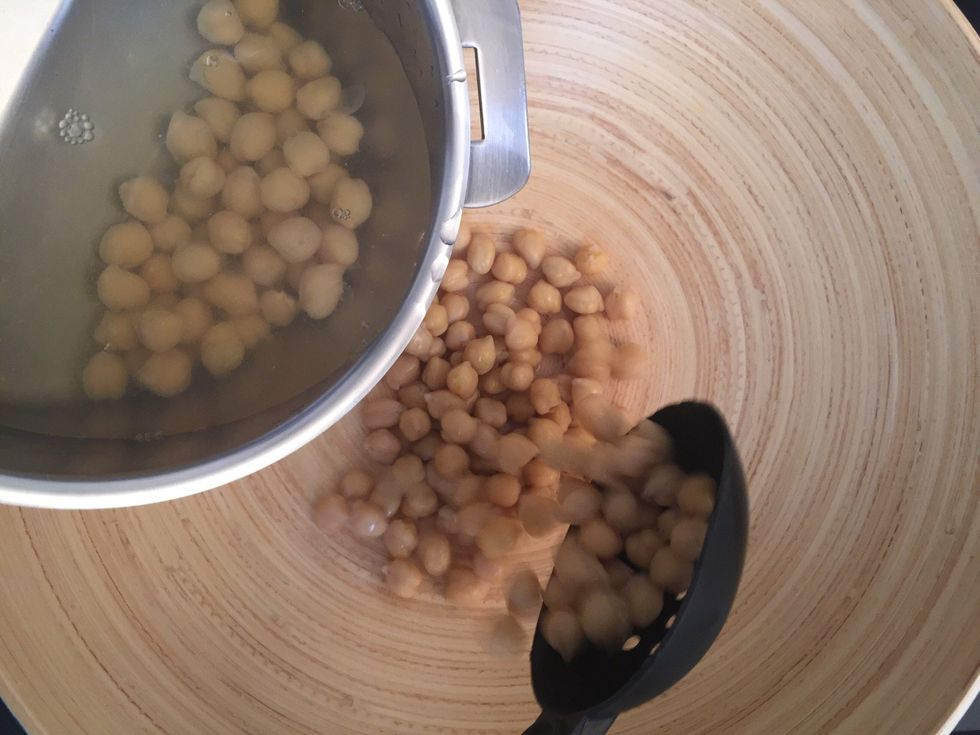 In the serving dish put the boiled hummus(garbanzo beans)