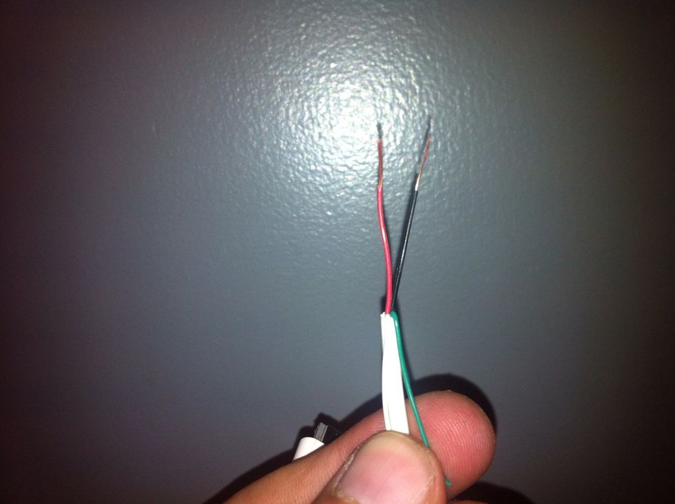 In this case we'll only need the red and black (negative and positive) wires. So cut or fold away the other two wires. Strip the casing off the red and black wires.