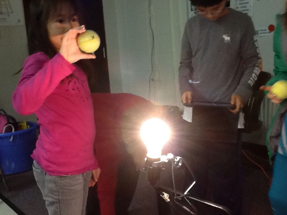 In this experiment, we dosidoed around a light bulb and saw the light hitting the earth at different angles.