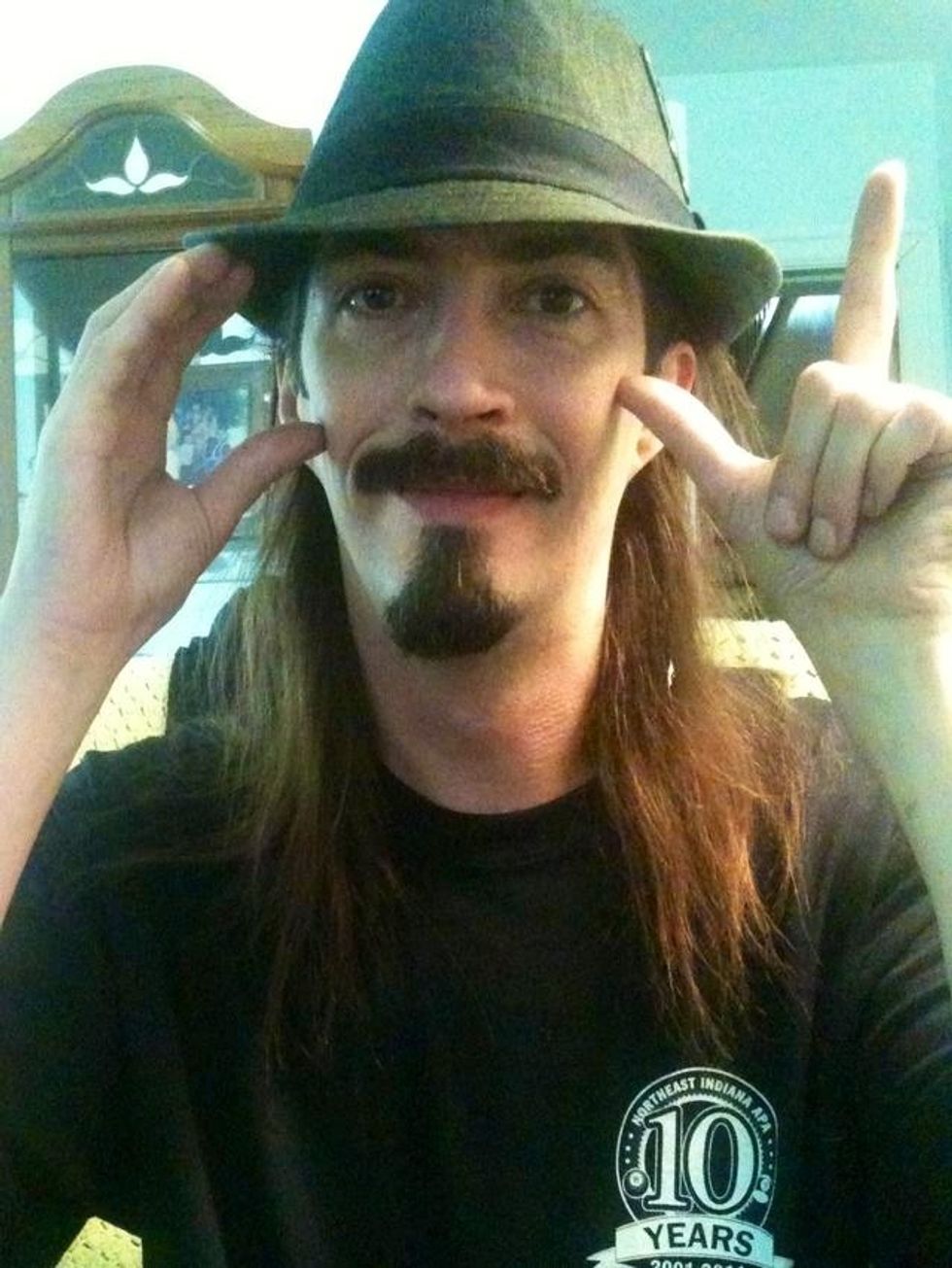 In this one and the next one. My two eyes represent two O's. So in this one my right hand is a "C" hand shape and my left hand is a "L" hand shape. Combines with my eyes this says "COOL".