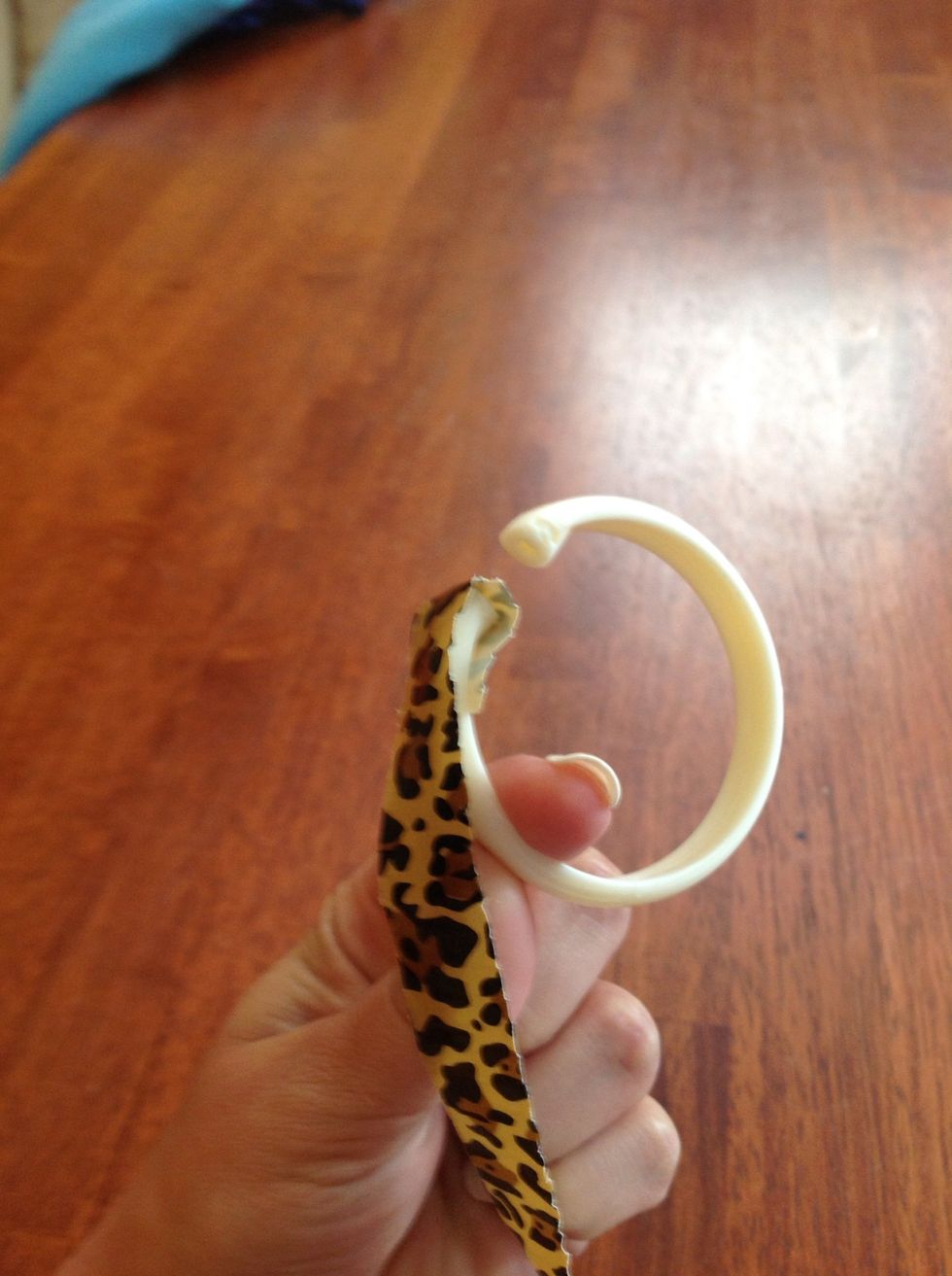 In this picture you can see that this is a different style of shower curtain ring. To make it usable I took an exacto knife and cut off the small bit of plastic that stuck out.