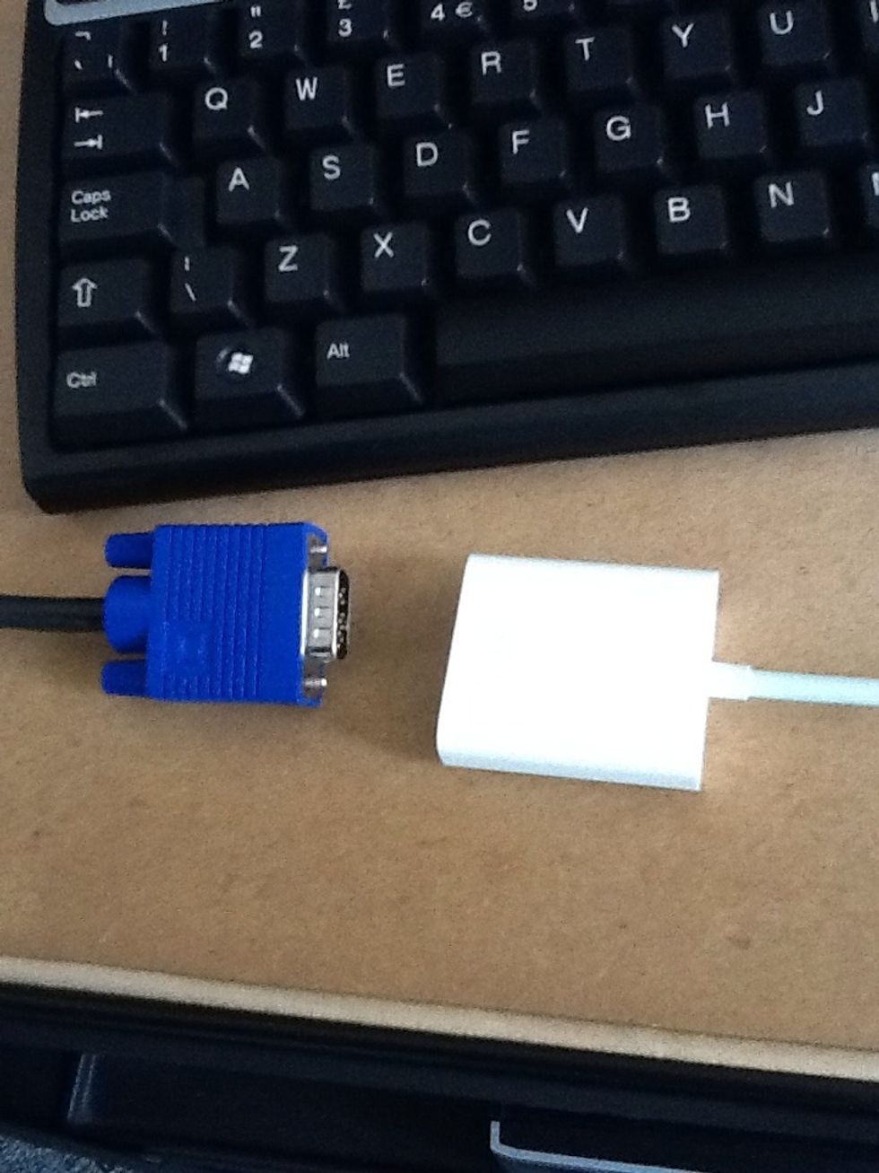 In this setup, we have an extra VGA lead using a Y-splitter cable so we can keep the PC connected at the same time. Connect the VGA cable to the iPad VGA adapter cable. Now connect the iPad.