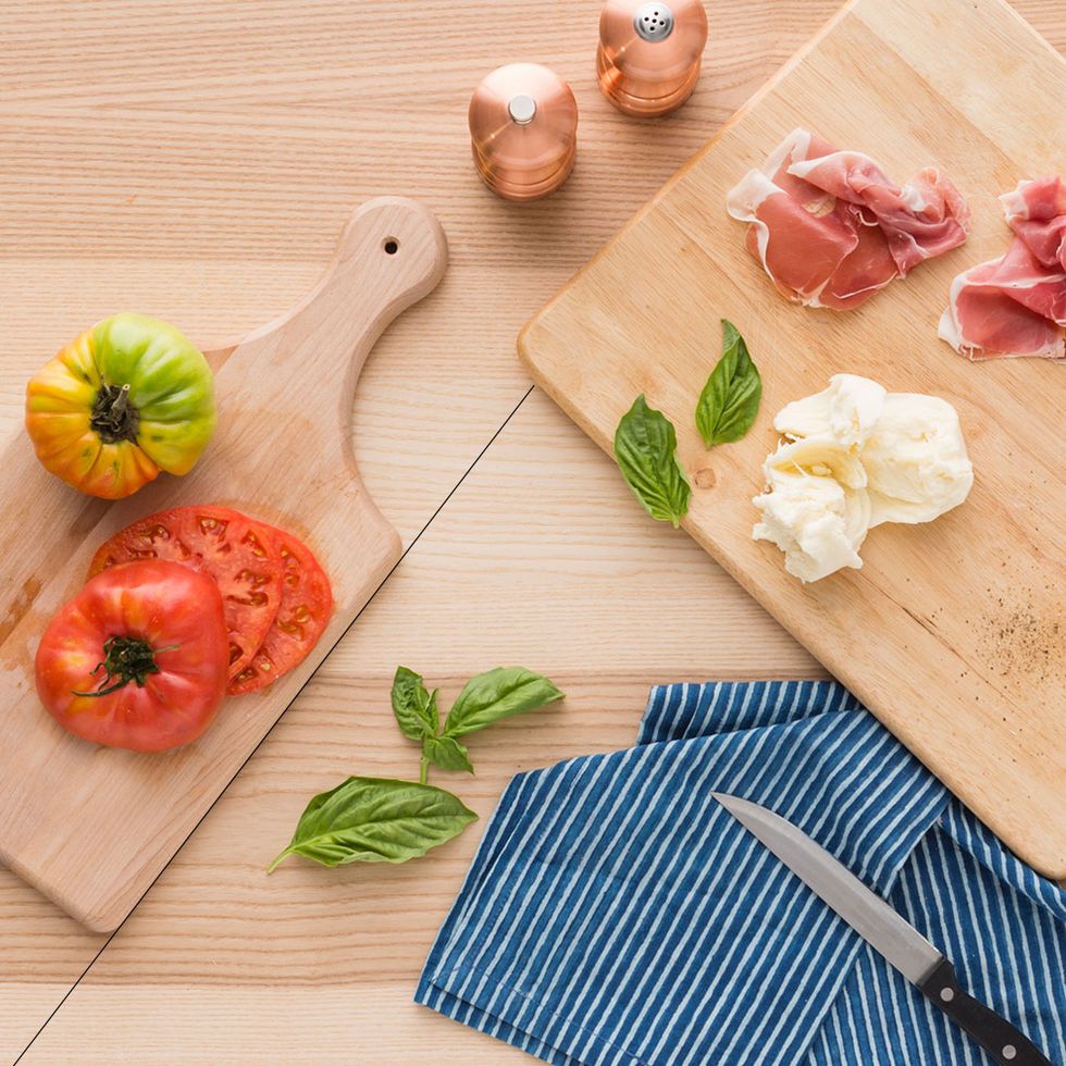 In this shot, the handled board provides a leading line, encouraging your eye to move toward the center of the frame. The second cutting board provides a line that also draws your eye in.