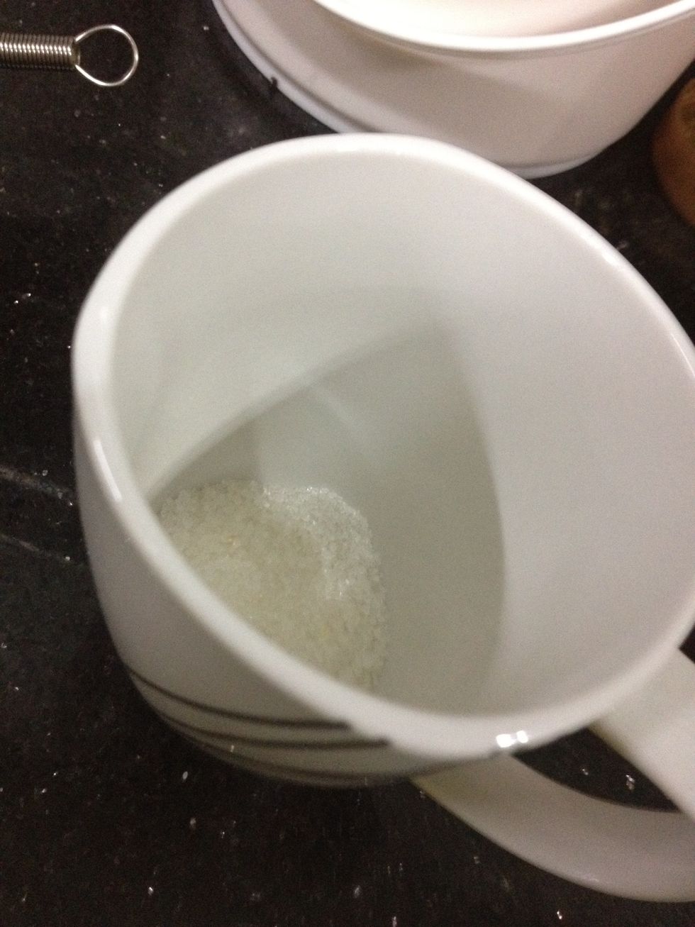 In your mug, make sure it's microwave safe, add in sugar, egg and vanilla.