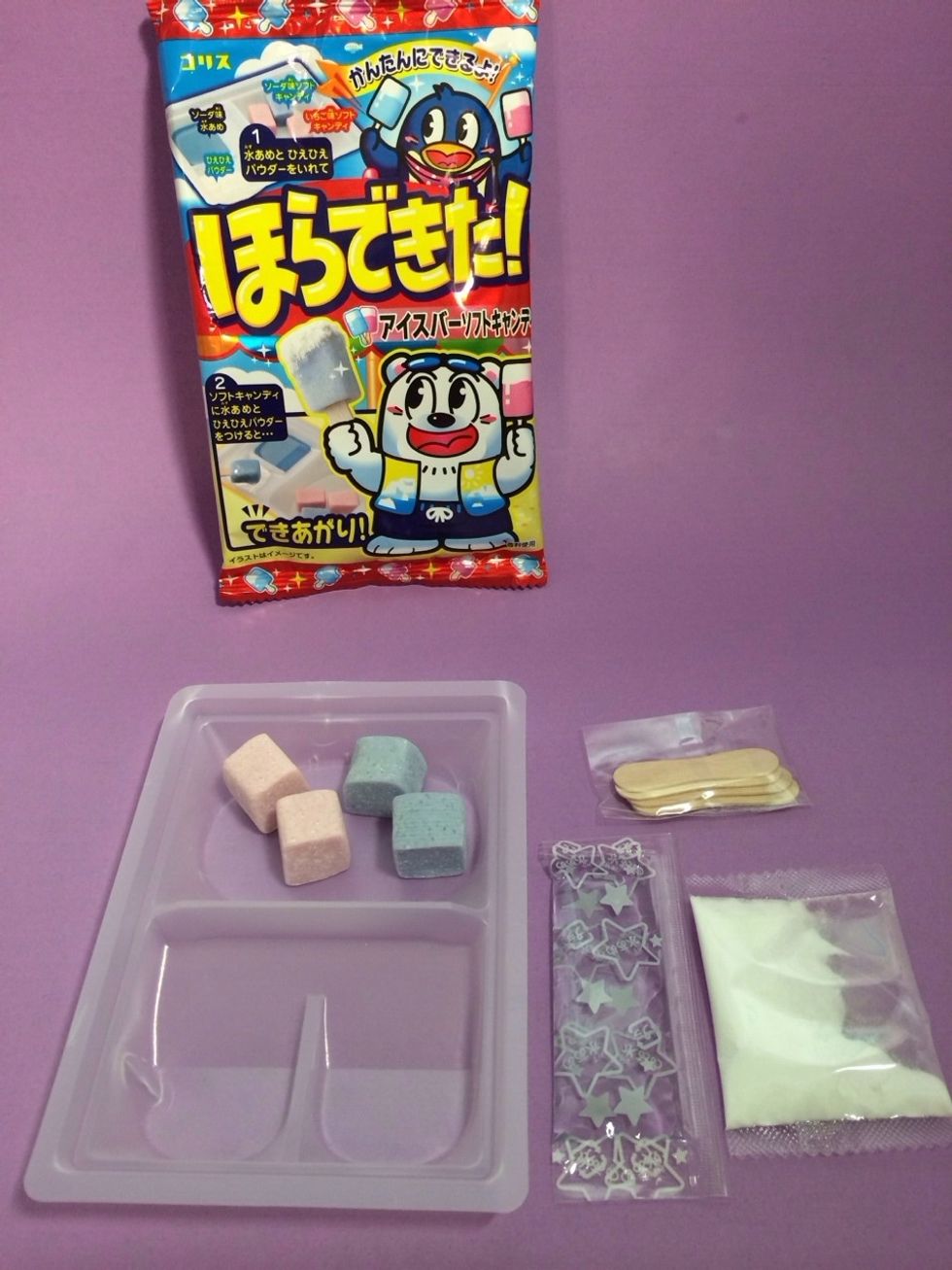 Included: Tray, CLEAR Pack Dipping Liquid, WHITE Powder Pack, Ice Bar Sticks, Chewy Popsicle Tops in BLUE Ramune and PURPLE Grape