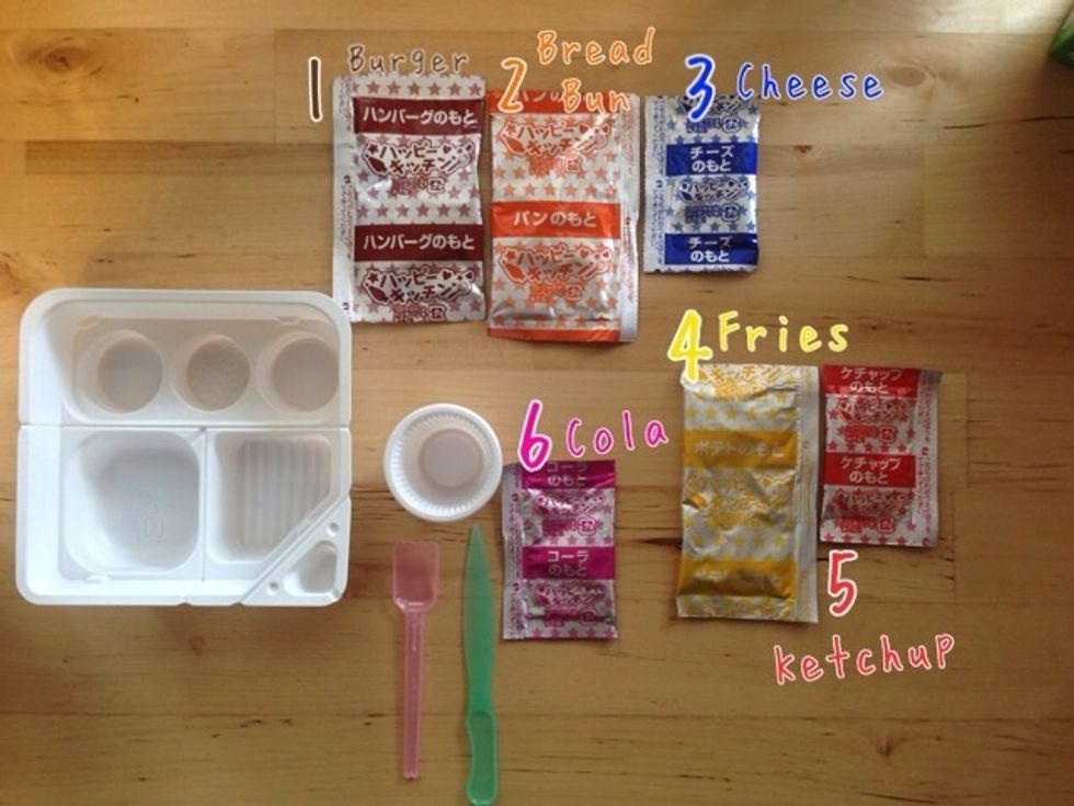 Included: Tray, which you will cut apart, Cup which you already labeled,spatula and knife, and 6 Powder Packs-1 BROWN-Burger 2 ORANGE-Bread Bun 3 BLUE-Cheese 4 YELLOW-Fries 5 RED-Ketchup 6 PINK-Cola