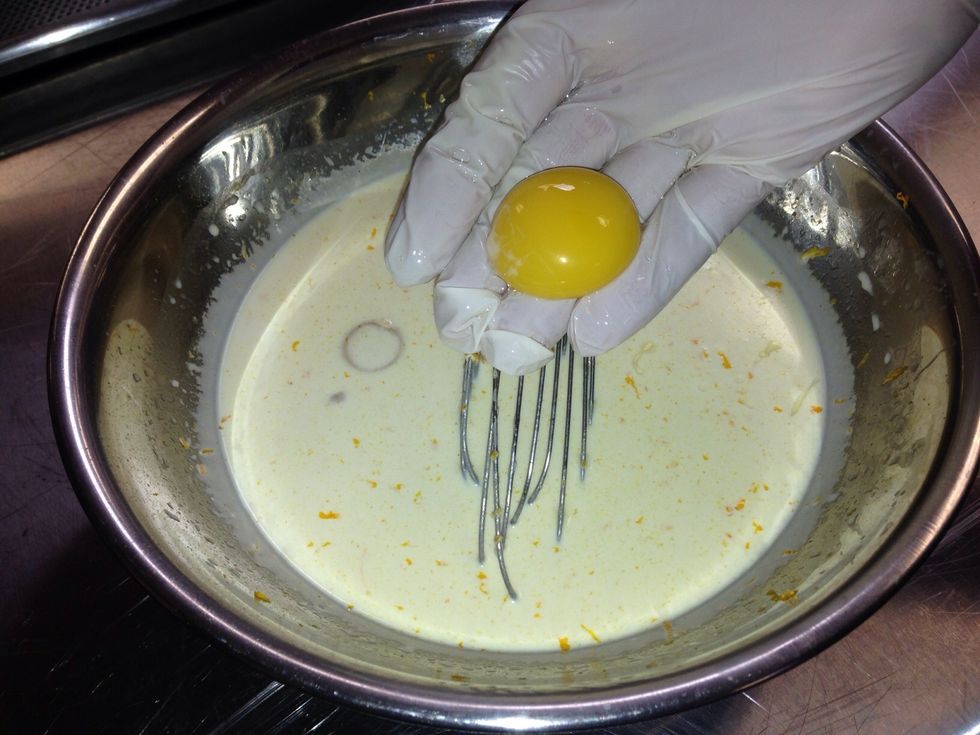 Incorporate yolks to tempered mixture