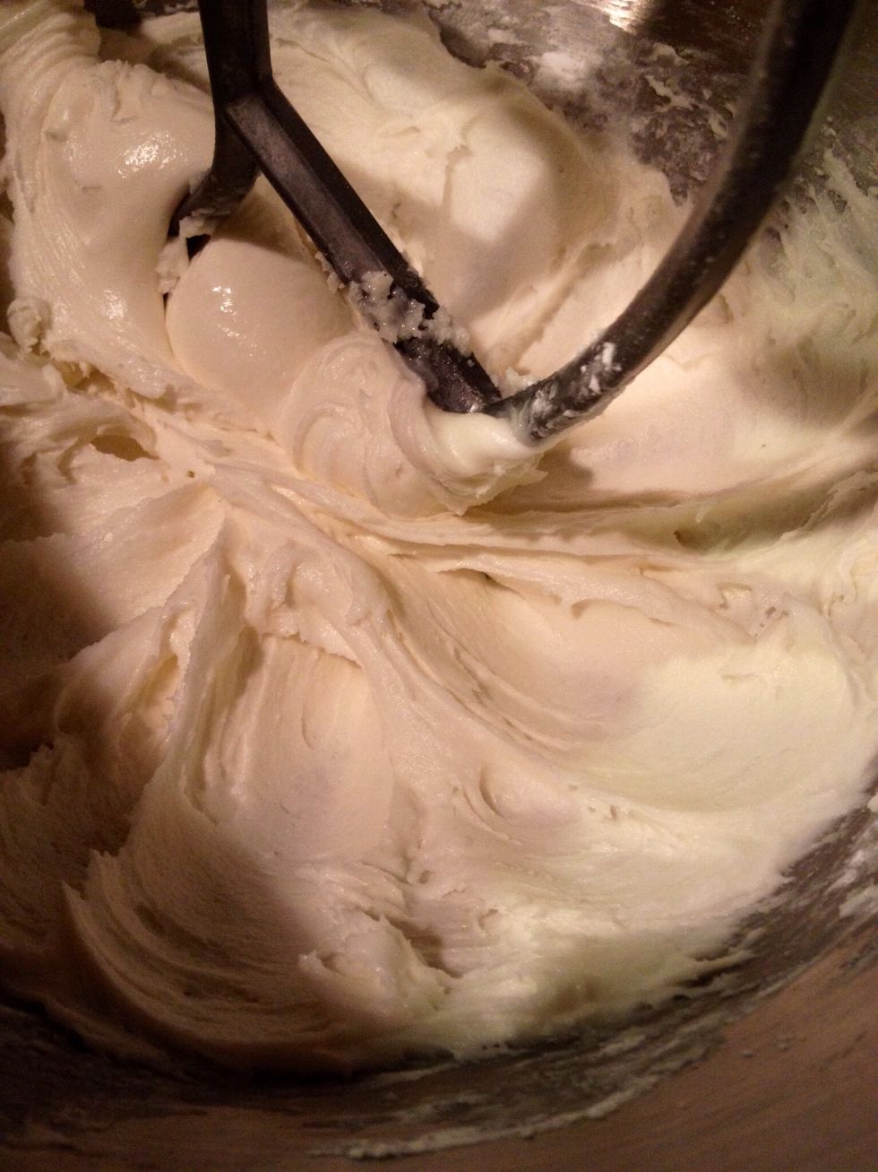 Increase the speed until light and creamy. It shouldn't stick when you touch it, but if it does, add confectioners' sugar a tablespoon at a time until you reach the consistency of Play-Doh.