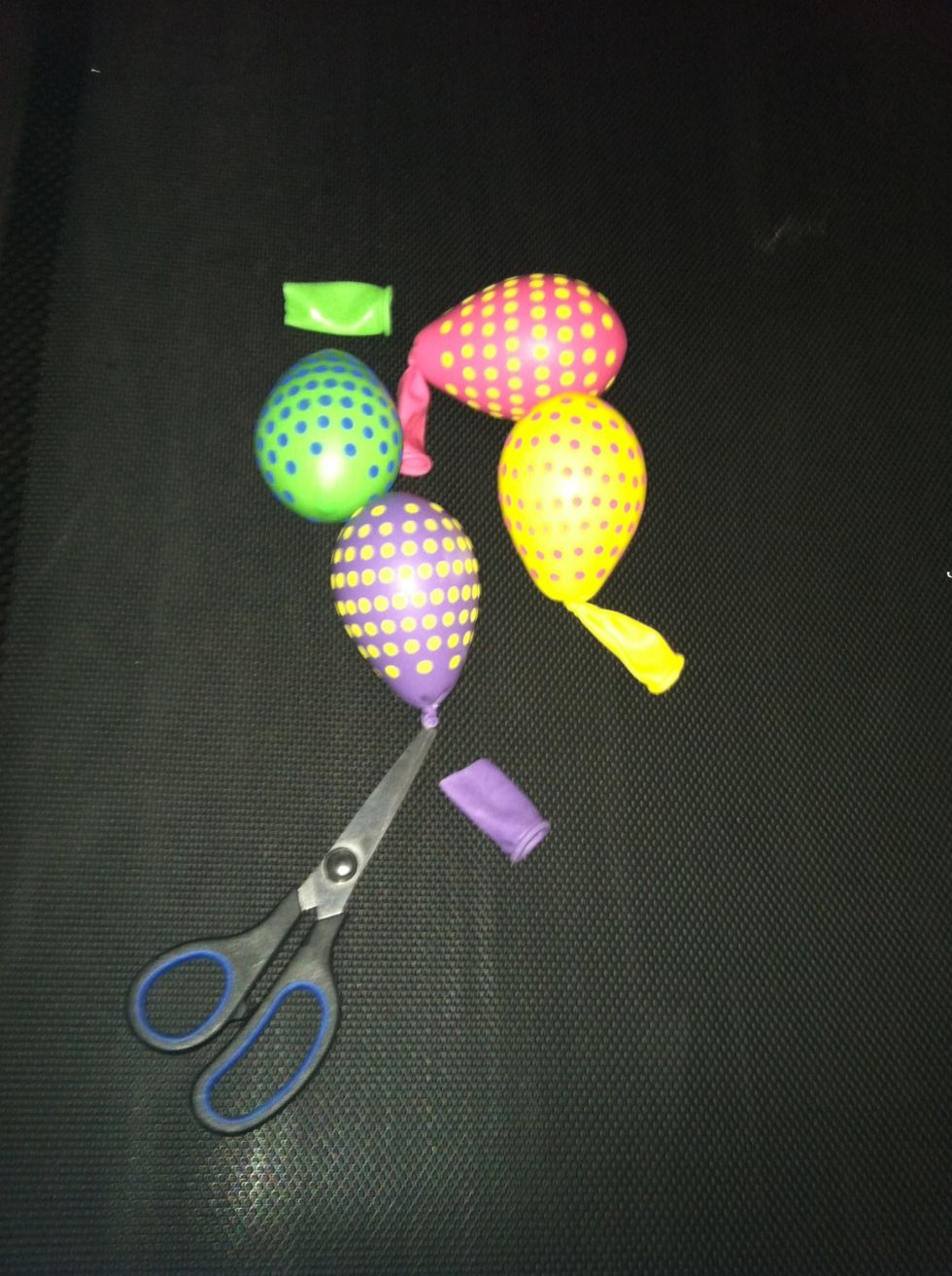 Inflate the 11" balloons with only a puff of air. Then tie off and cut off necks.