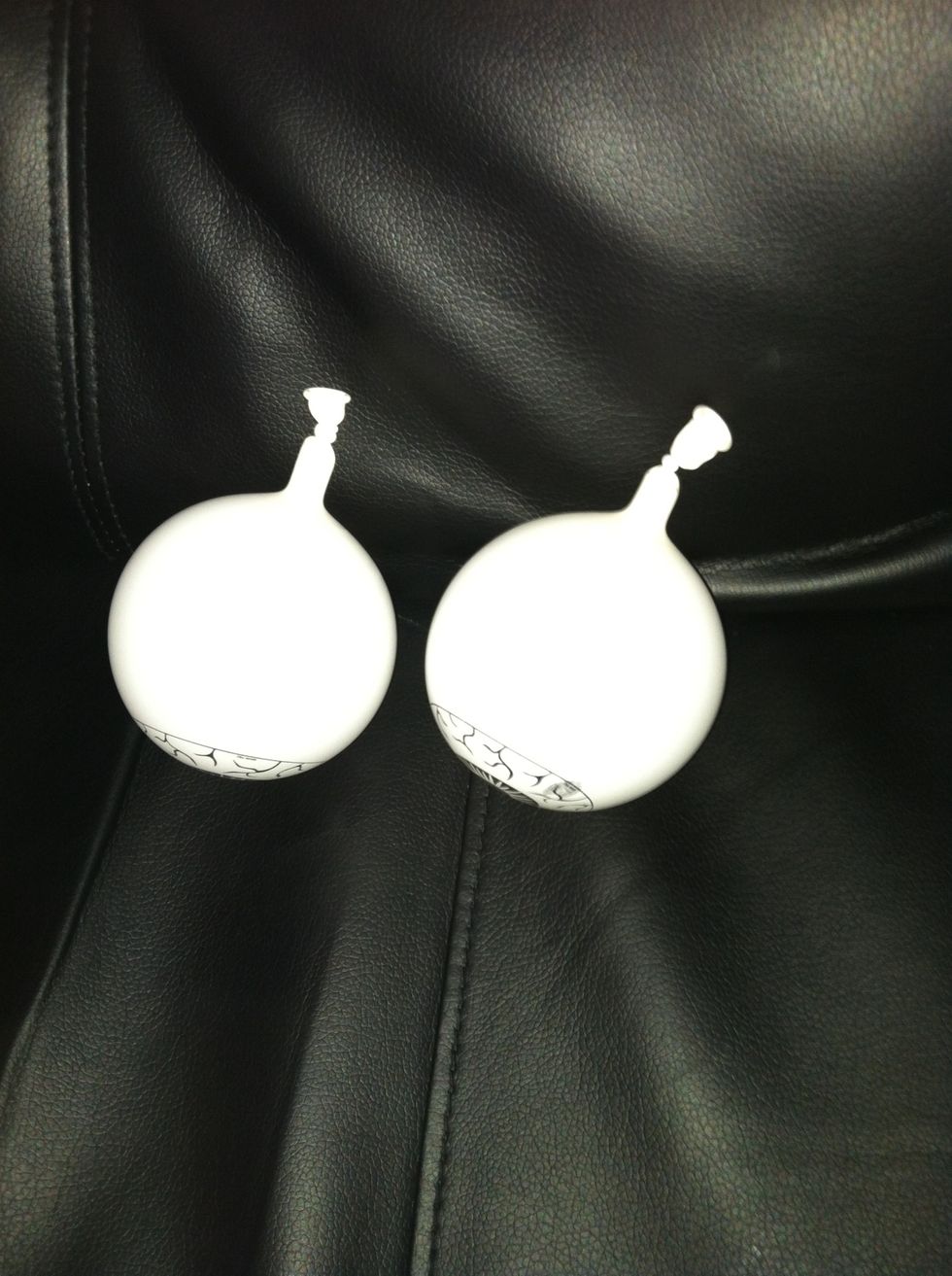 Inflate the small round balloons (or eyeballs) to about 2.5"- tying off close to the nozzle