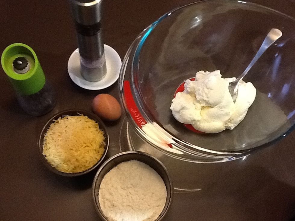 Ingredients - 500g ricotta cheese, 1 egg, 100g grated Parmesan cheese, 1 cup plain flour (plus extra for dusting), salt, pepper, ground pimento (allspice)