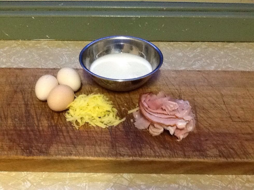 Ingredients are 3 eggs a handful of cheese ham and milk.