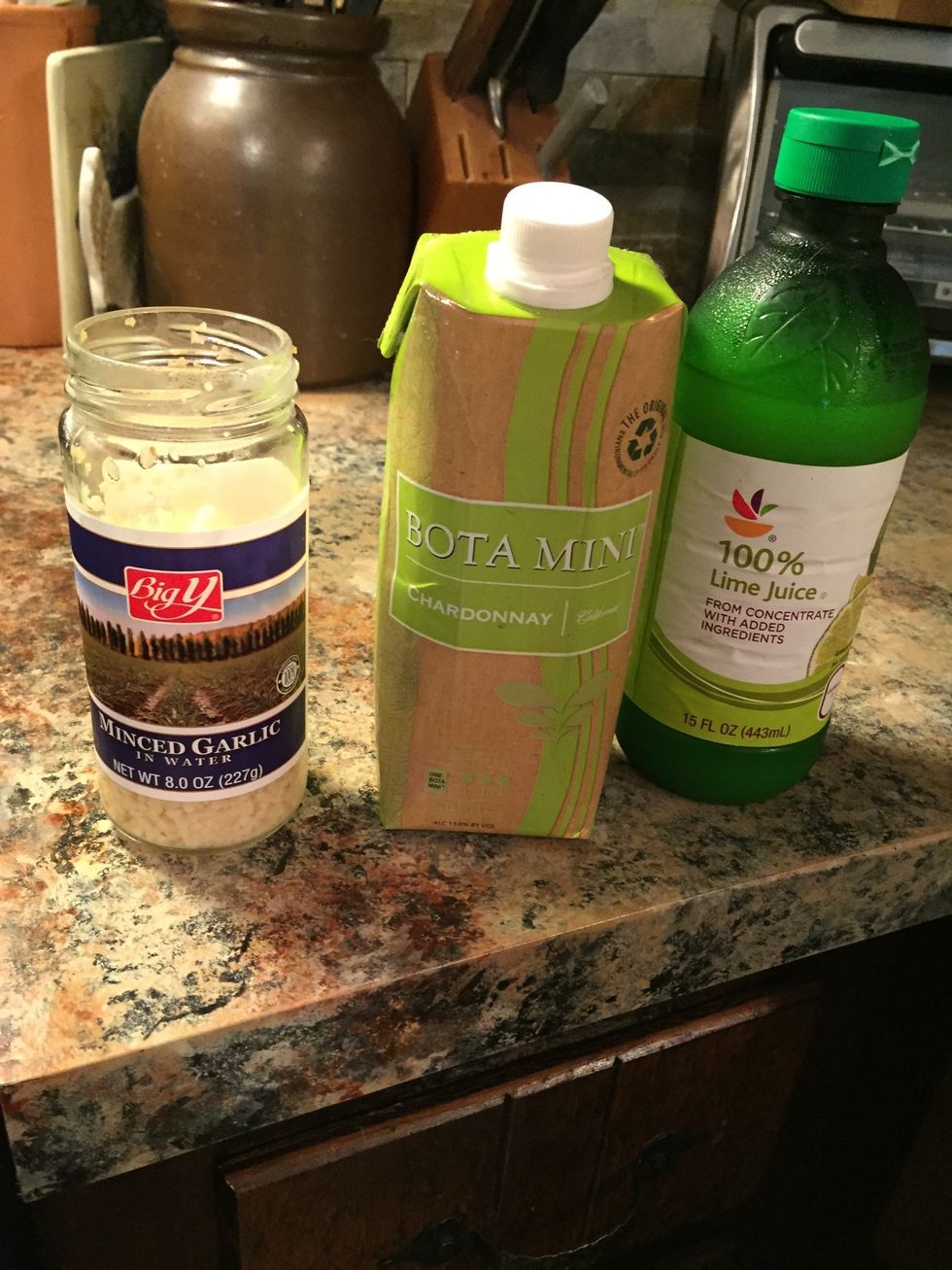 Ingredients are garlic, lime juice (or lemon) and white wine