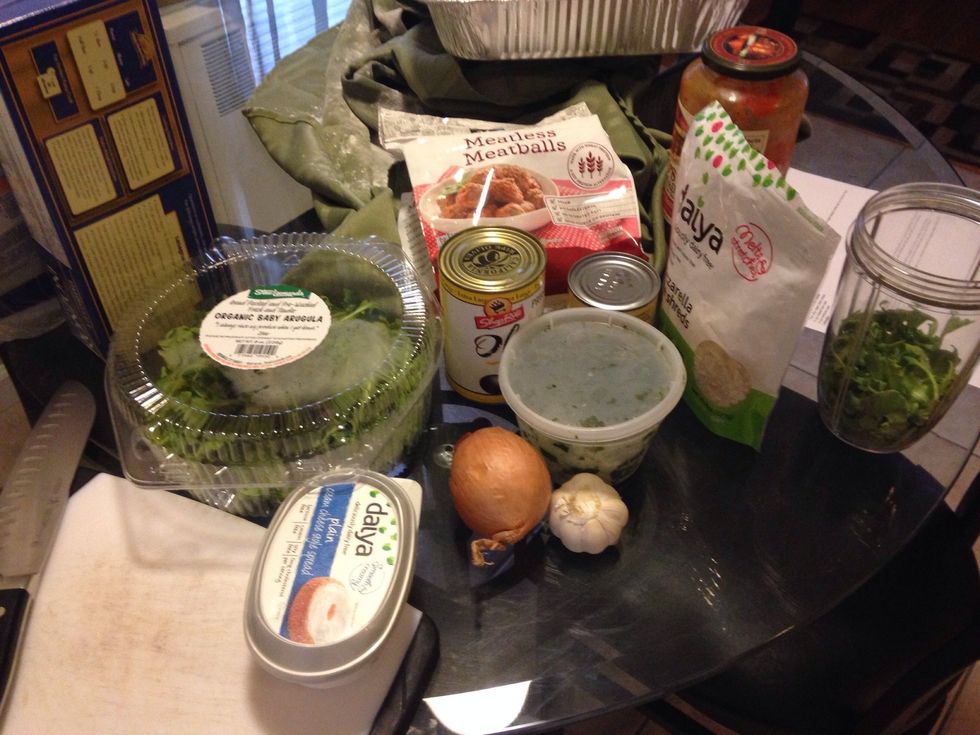 Ingredients: filling- cauliflower, black olives, mushrooms. Sauce- spinach or arugula, vegan cream cheese, onions, olive oil, tomato sauce, garlic. layers- lasagna noodles and daiya mozzarella cheese.