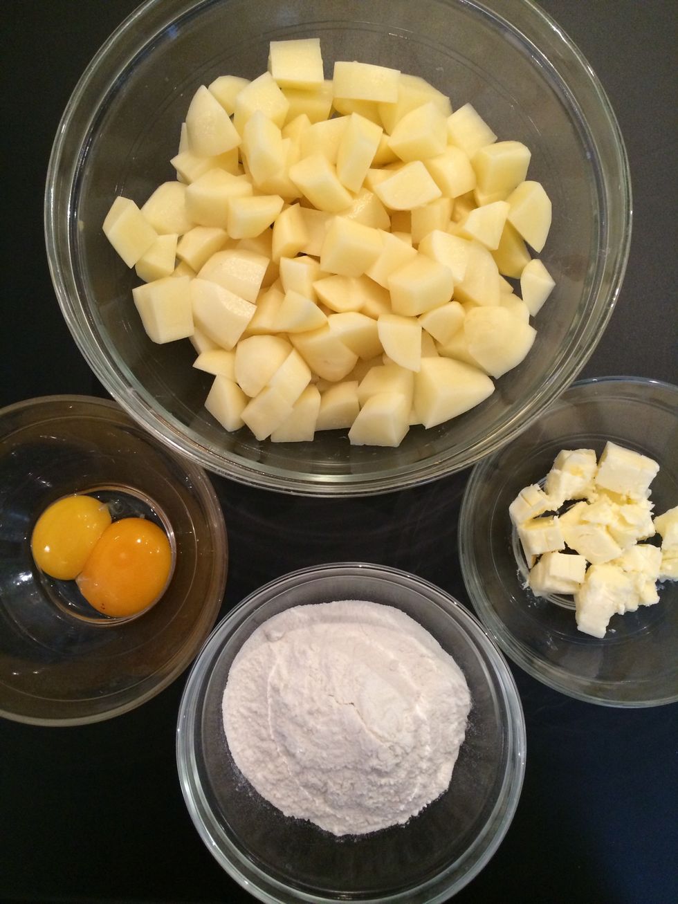 Ingredients for 1/2 the recipe. Boil the potatoes. Mash and add the butter, flour and the the egg yolks. Add salt and nutmeg