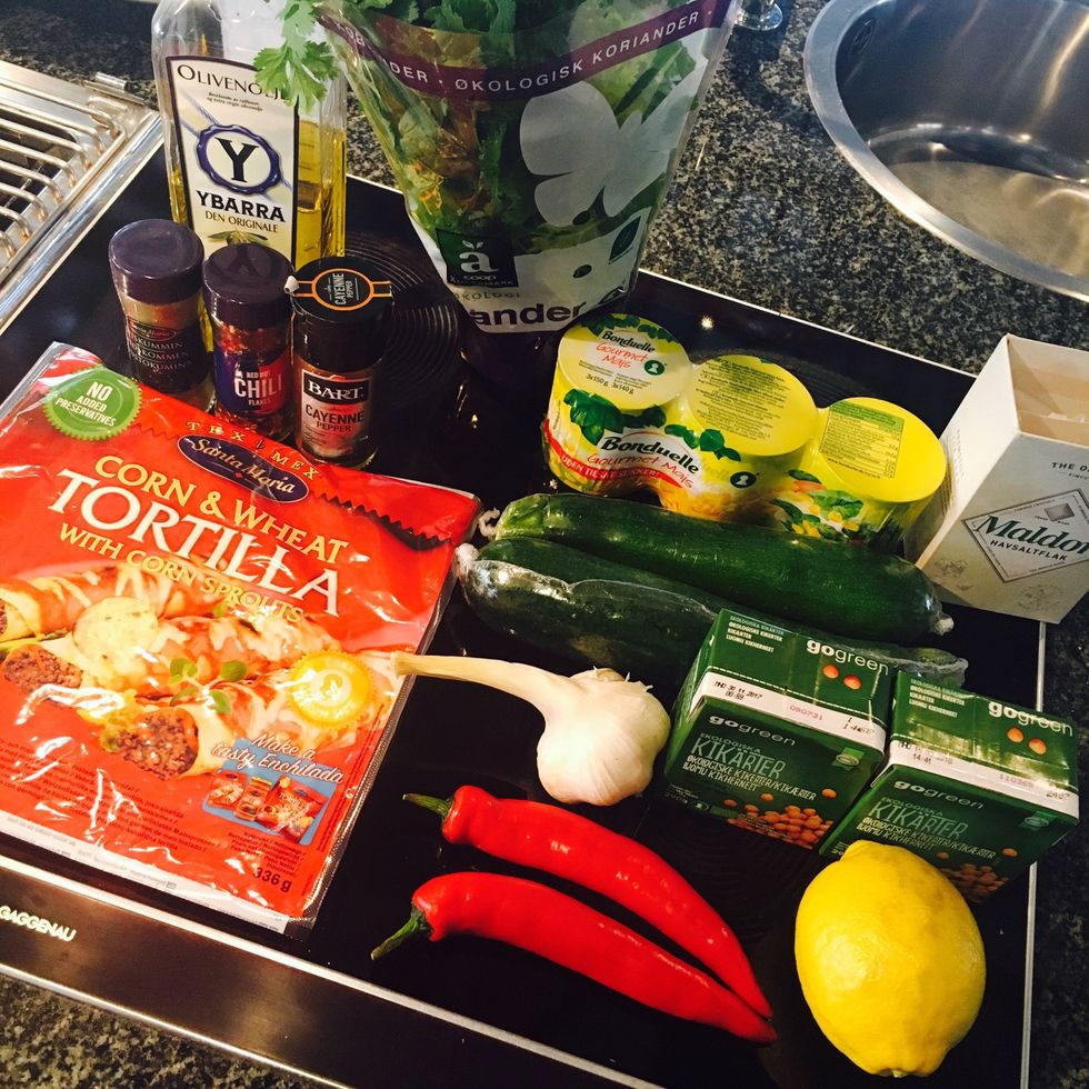 Ingredients: fresh coriander, chickpeas, corn, chili flakes, cayenne pepper, salt, cumin, garlic , red chili, lemon, summer squash, olive oil, corn wraps + lime to serve