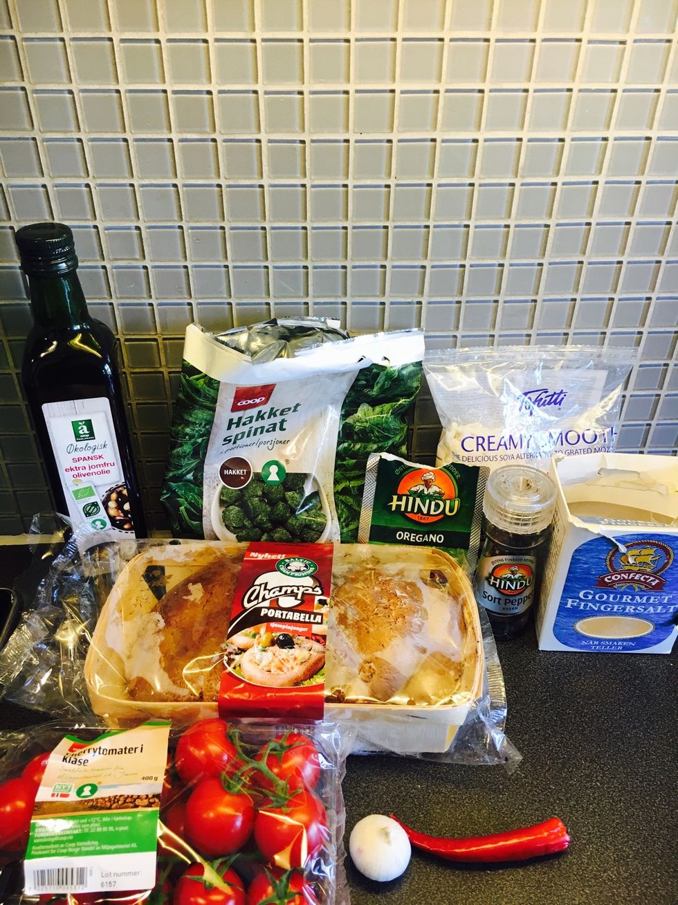 Ingredients: portobello mushrooms, frozen spinach, cherry tomatoes, chili, garlic, dried oregano, tofutti/vegan cheese, black pepper, salt, olive oil.