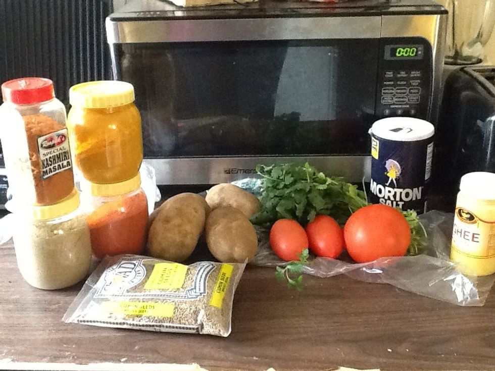 Ingredients: salt, sugar, tomatoes, cilantro, ginger, turmeric powder, coriander-cumin powder, canola oil/ghee, paprika, Kashmiri/garam masala, frozen peas and carrots