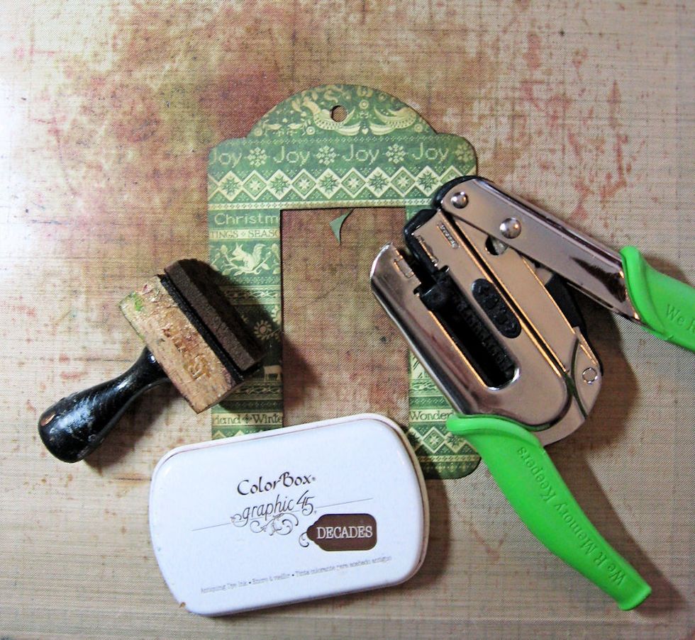 Ink all edges with Graphic 45 Photogenic Decades Ink. Punch a hole in the top of the tag.