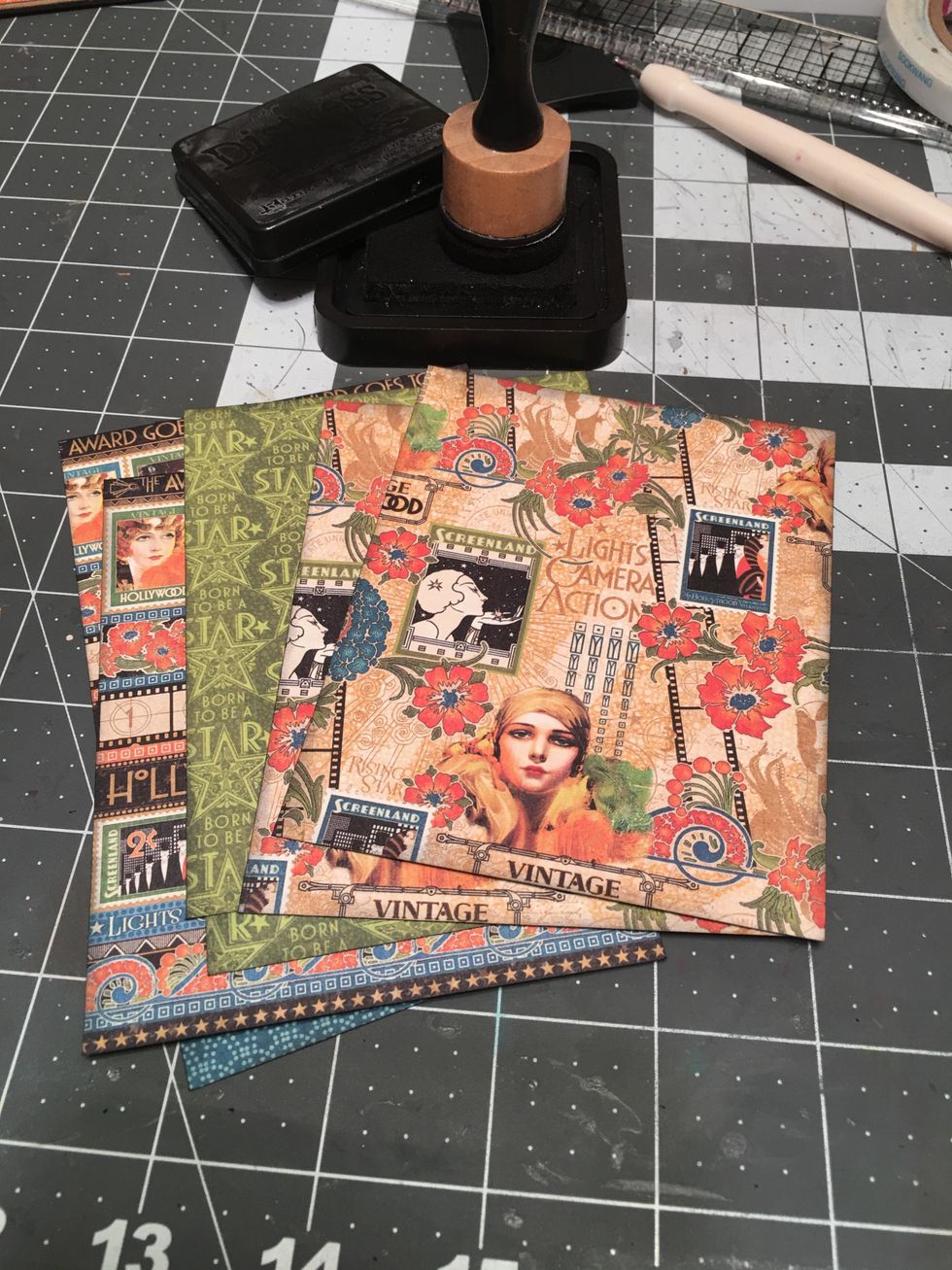 Ink all of the patterned papers you pre-cut for the pages.