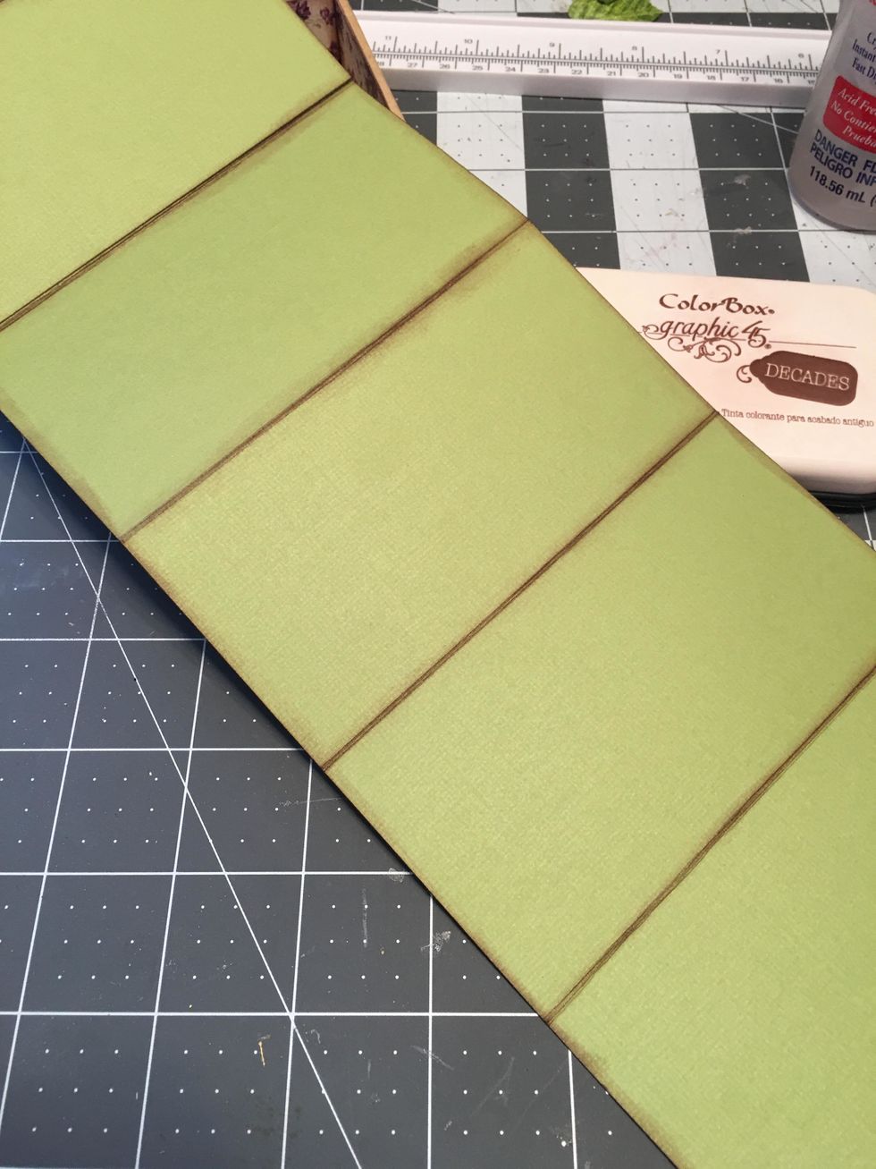 Ink all the edges and folds on both sides of the green cardstock fold out piece.