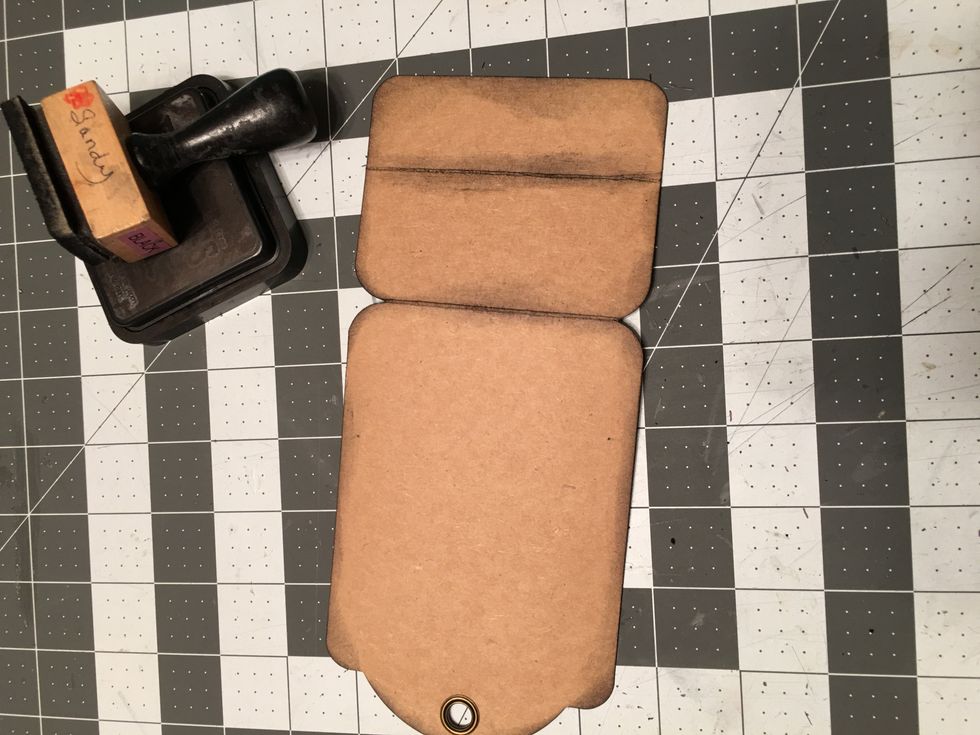 Ink all the edges of this piece front and back and along the fold lines with Black Soot Distress Ink.