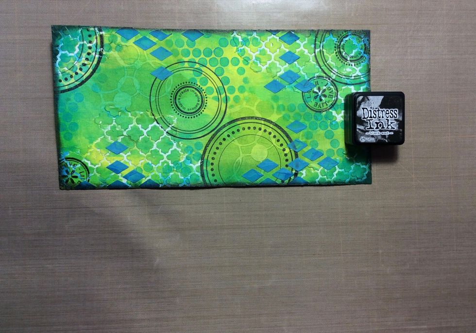 Ink around the edges with black ink. I used distress ink black soot