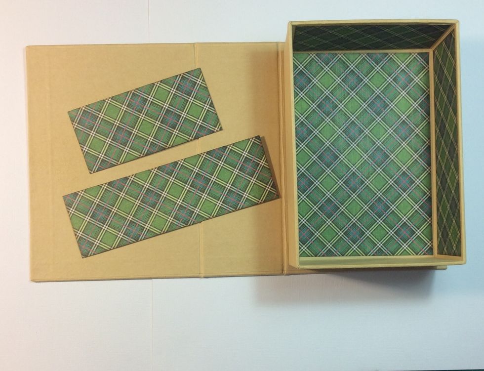 Ink edges of internal mats if desired apply tape to back and adhere to inside of book box. Burnish with bone folder.
