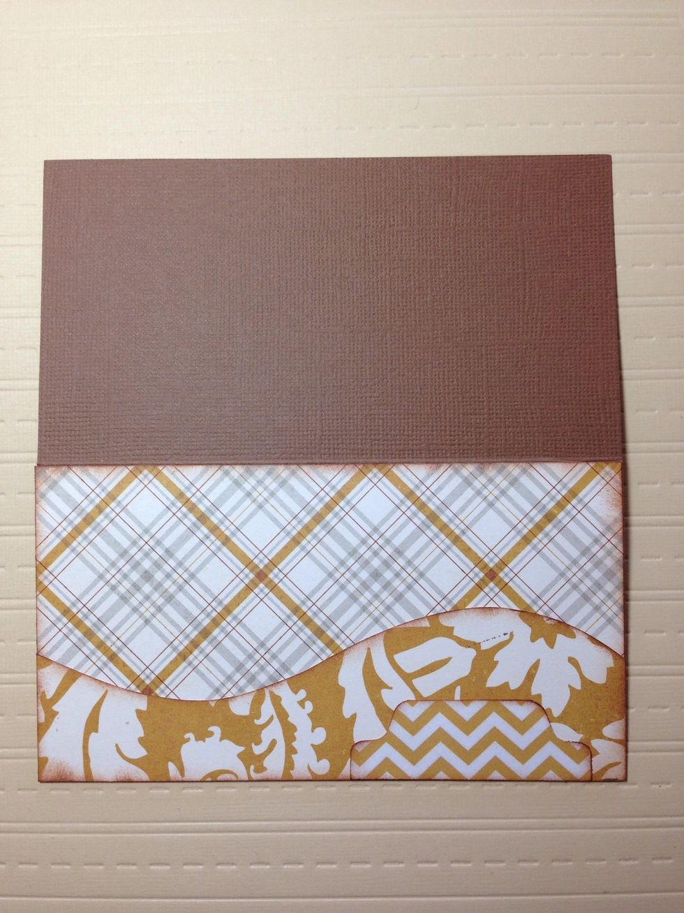 Ink the edges and add adhesive along the bottom and sides only before adding it to the card. Add another pattern paper to create a place to write a name. I used a tab punch.