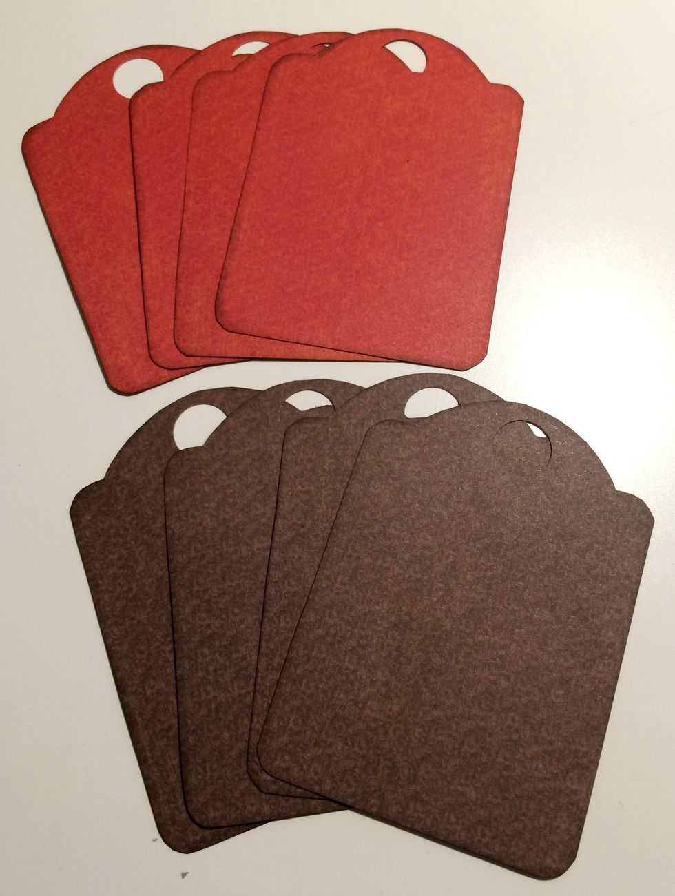 Ink the edges of the cut out paper tags using a blending tool and Walnut Stain Distress Ink.