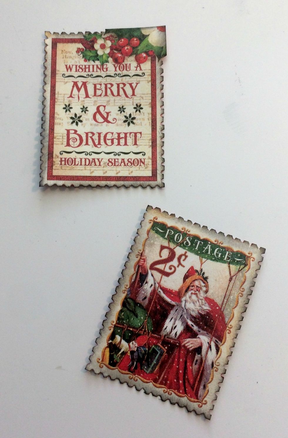 Ink the edges of the postage stamps using Black Soot Distress Ink and a blending tool.