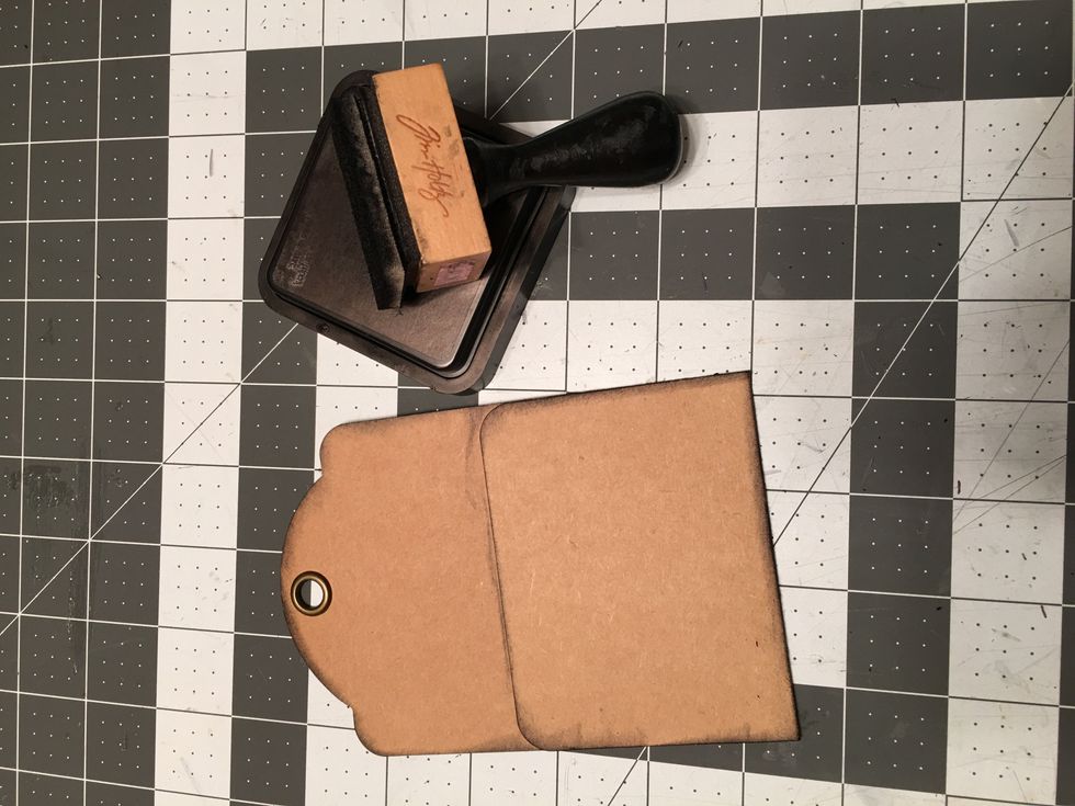 Ink the edges of the tags on the front & back with Black Soot Distress Ink.