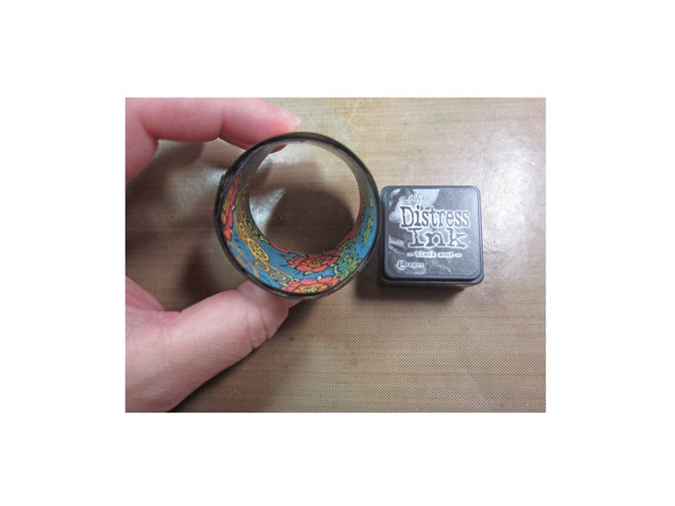 Ink the edges with black ink to blend it all together.