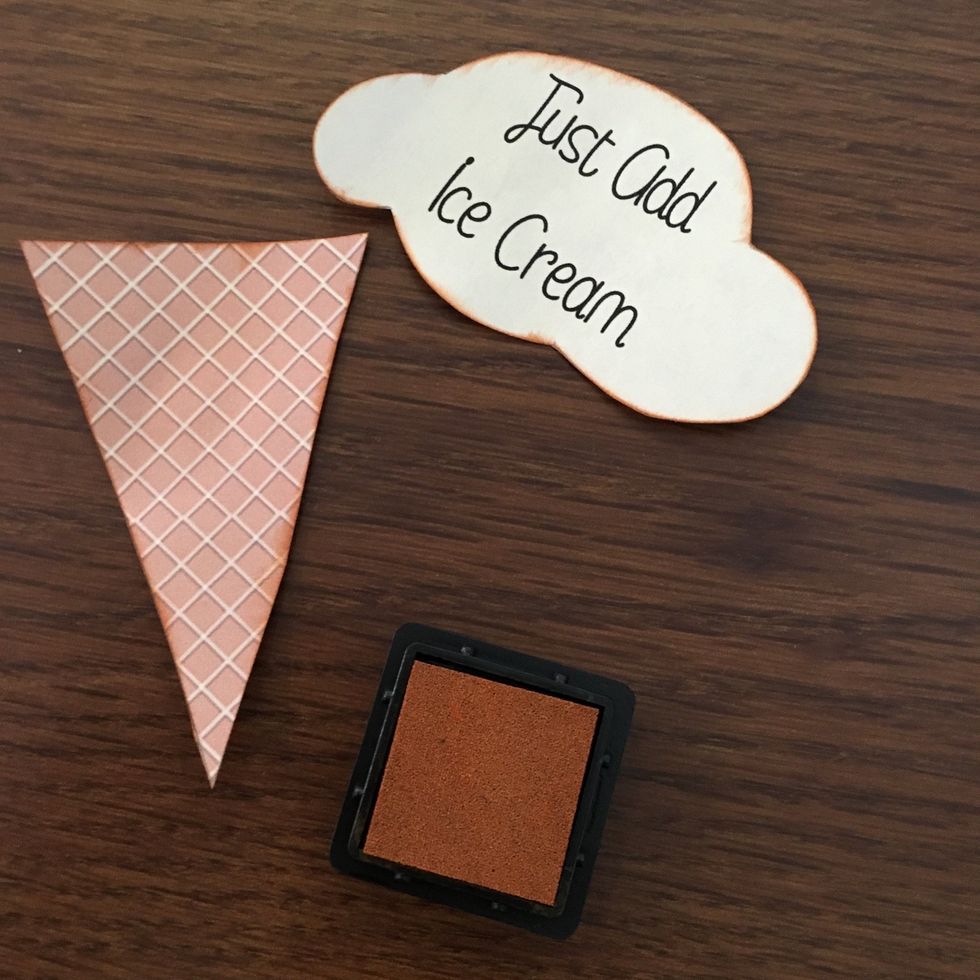 Ink the edges with brown ink. https://lindsay.kiwilaneinstructor.com/store/default/distress-ink.html