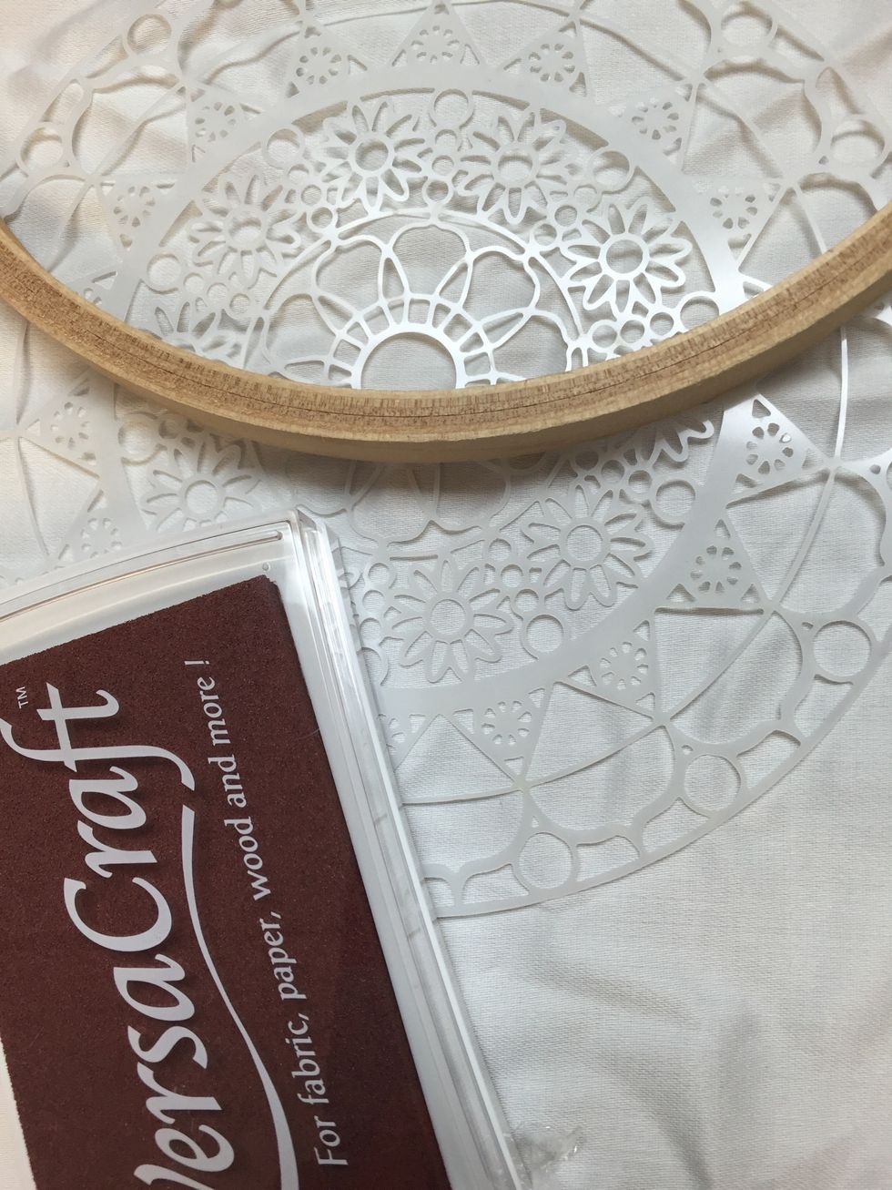 Ink your stencil and use it like a stamp on fabric