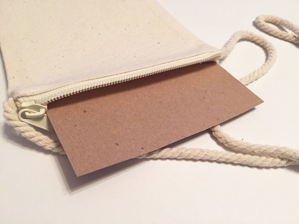 insert a piece of chipboard inside purse to prevent bleeding of inked designs to other side.