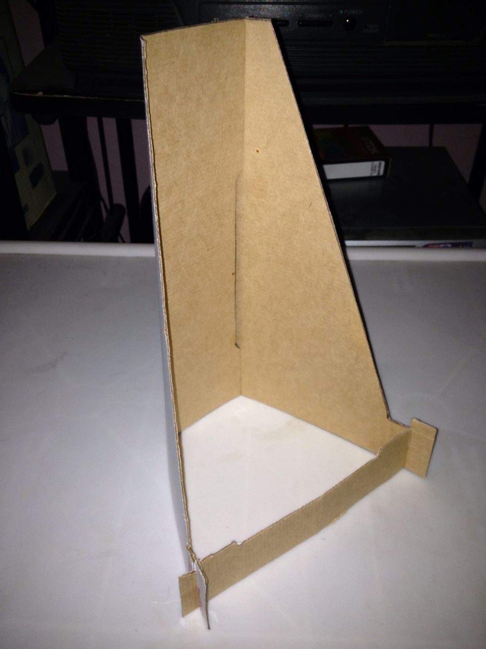 Insert bracket into the cuts of the base part