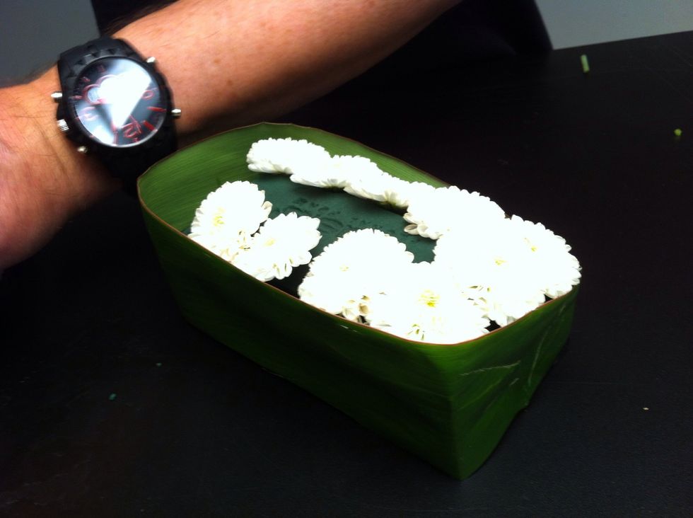 Insert button mums around edge of foam.