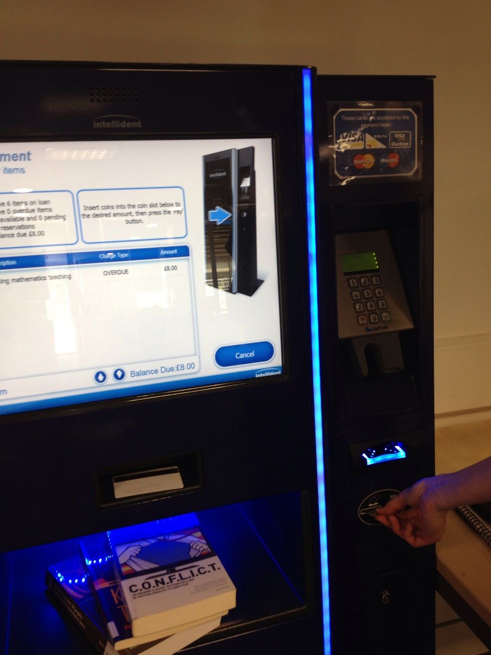 Insert cash into the payment slot. If you pay by card you will be asked to choose how much you wish to pay.