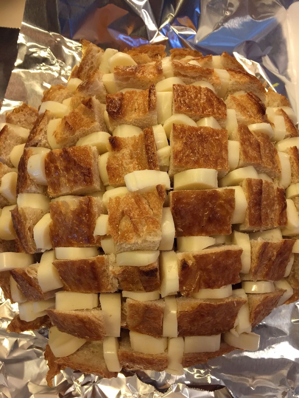 Insert cheese slices between the cuts.