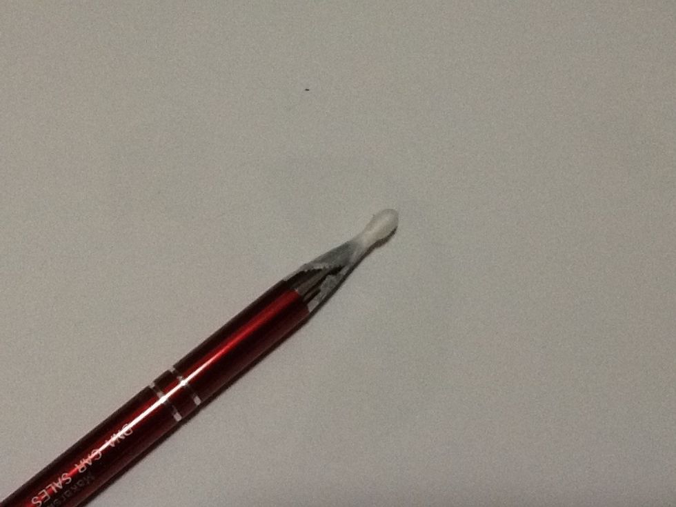 Insert cotton bud into pen and secure with tape.