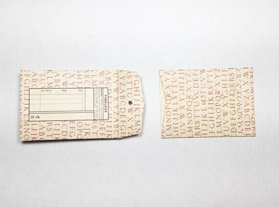 Insert created pages into envelope with top tab cut off. Your album should now be assembled.