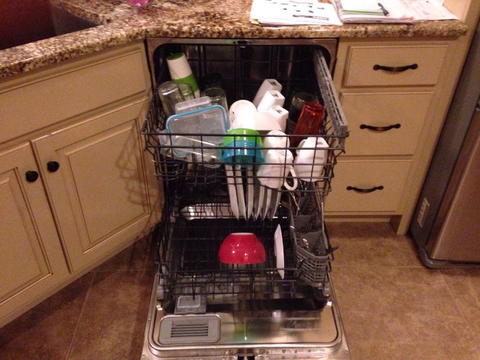 Insert dirty dishes into the dishwasher