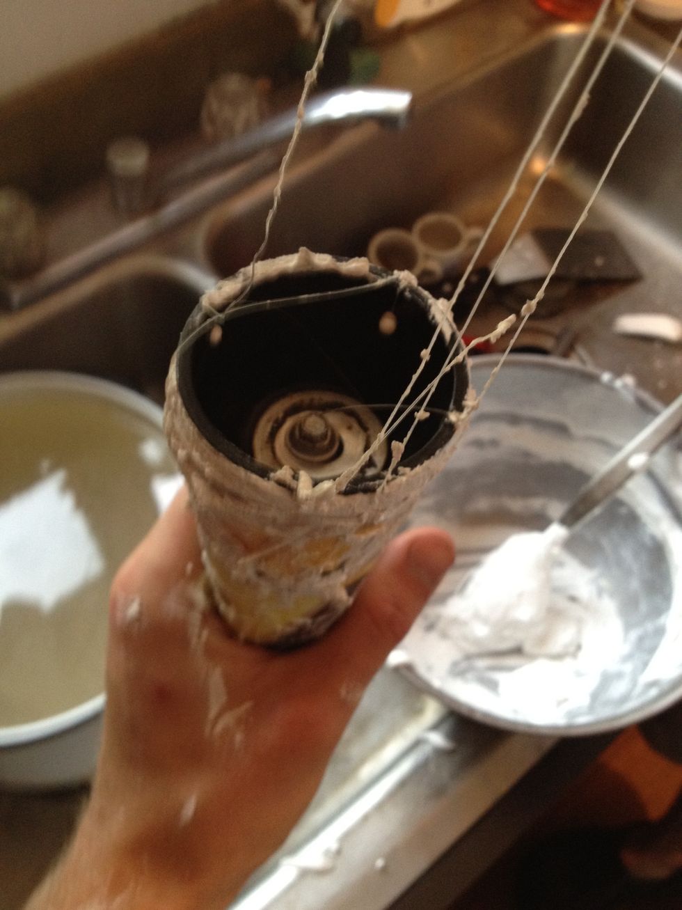 Insert dowel and plastic ring into plaster