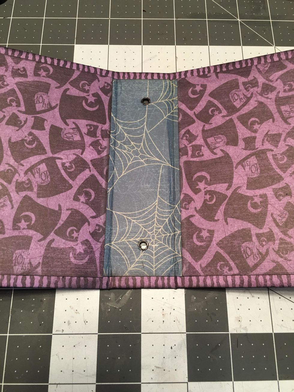 Insert eyelets into the spine holes and set with the Crop-a-dile or your favorite method of installing eyelets.