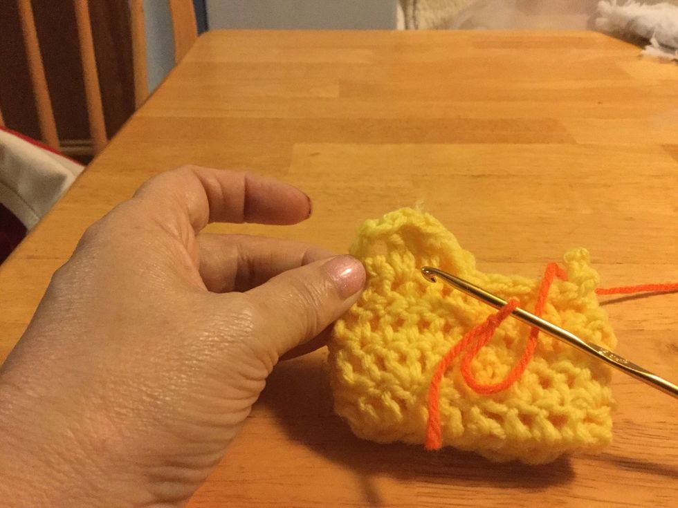 Insert hook through the hole between the DC and the HDC.