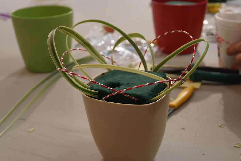 Insert into the Foam, interweaving with the Lily Grass