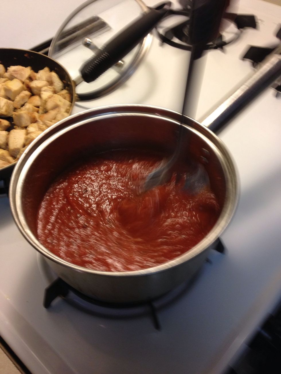 Insert pasta sauce into a sauce pan