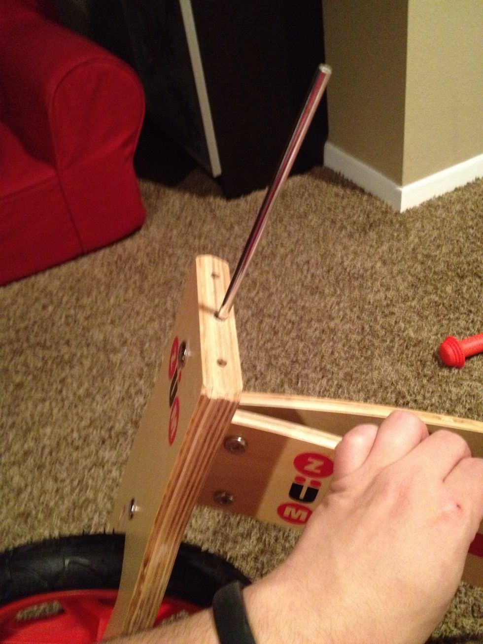 Insert pin all the way through the axle.